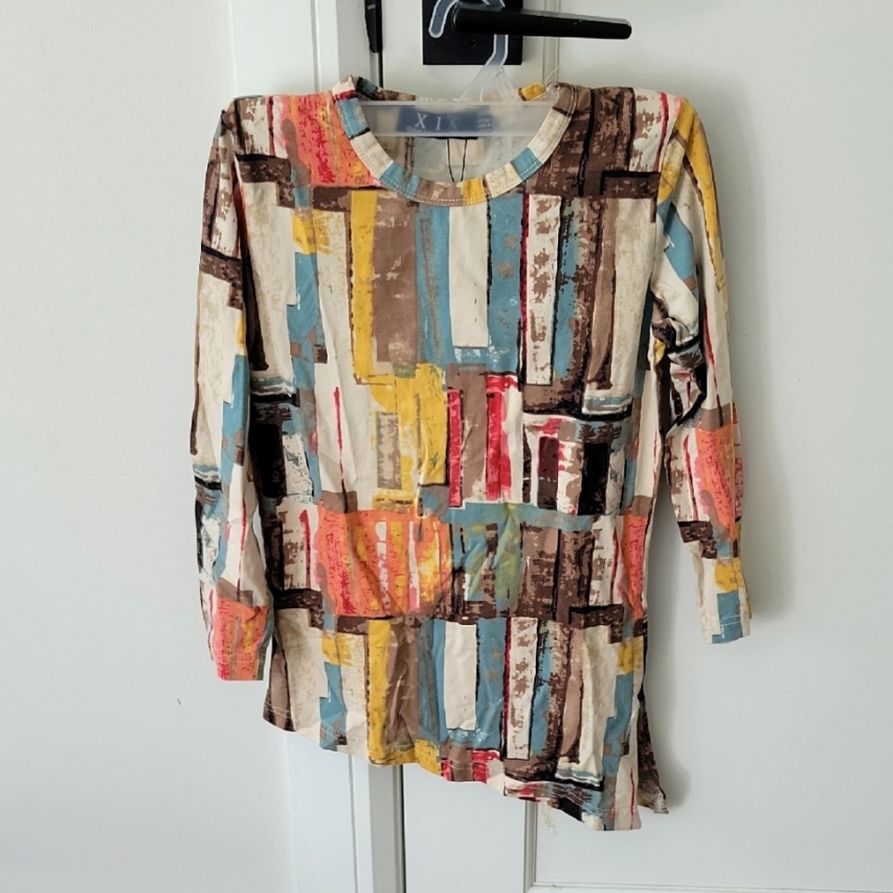 Colorful Abstract Long Sleeve Top Bottom Goes Lower At A Slant.